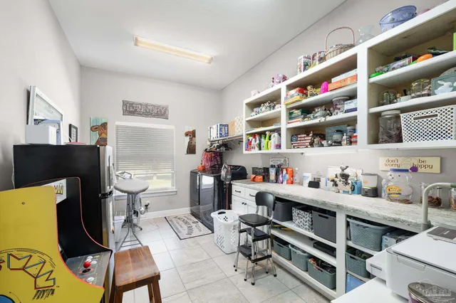 a bathroom with a shower curtain and a toilet