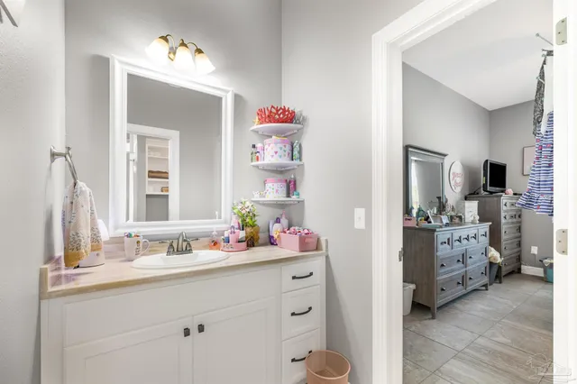 a view of a porch with furniture and floor to ceiling window