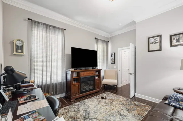 a view of a dining room with furniture and chandelier