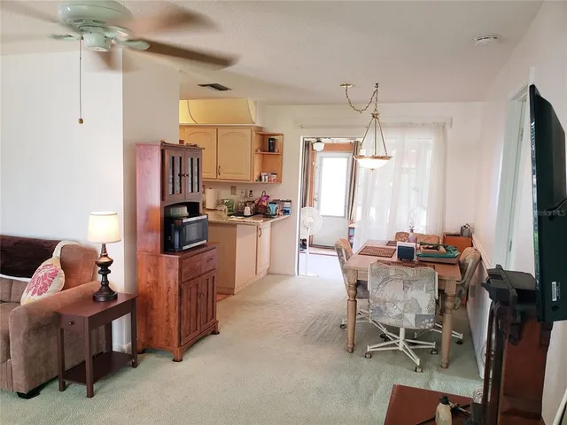 a view of a dining room with furniture window and outside view