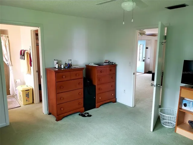 a room with furniture and mirror