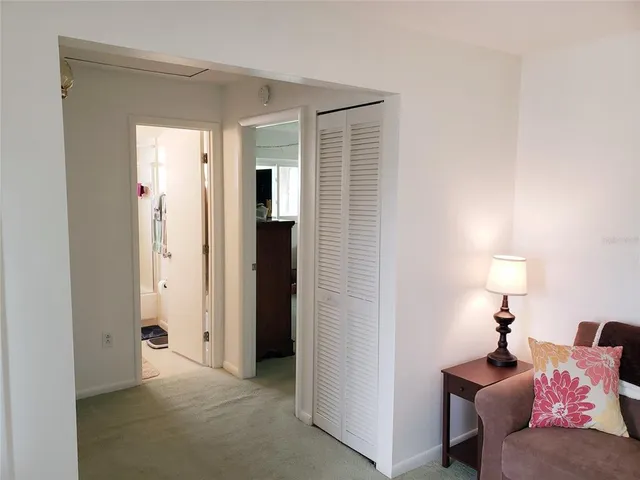 a living room with furniture and a lamp