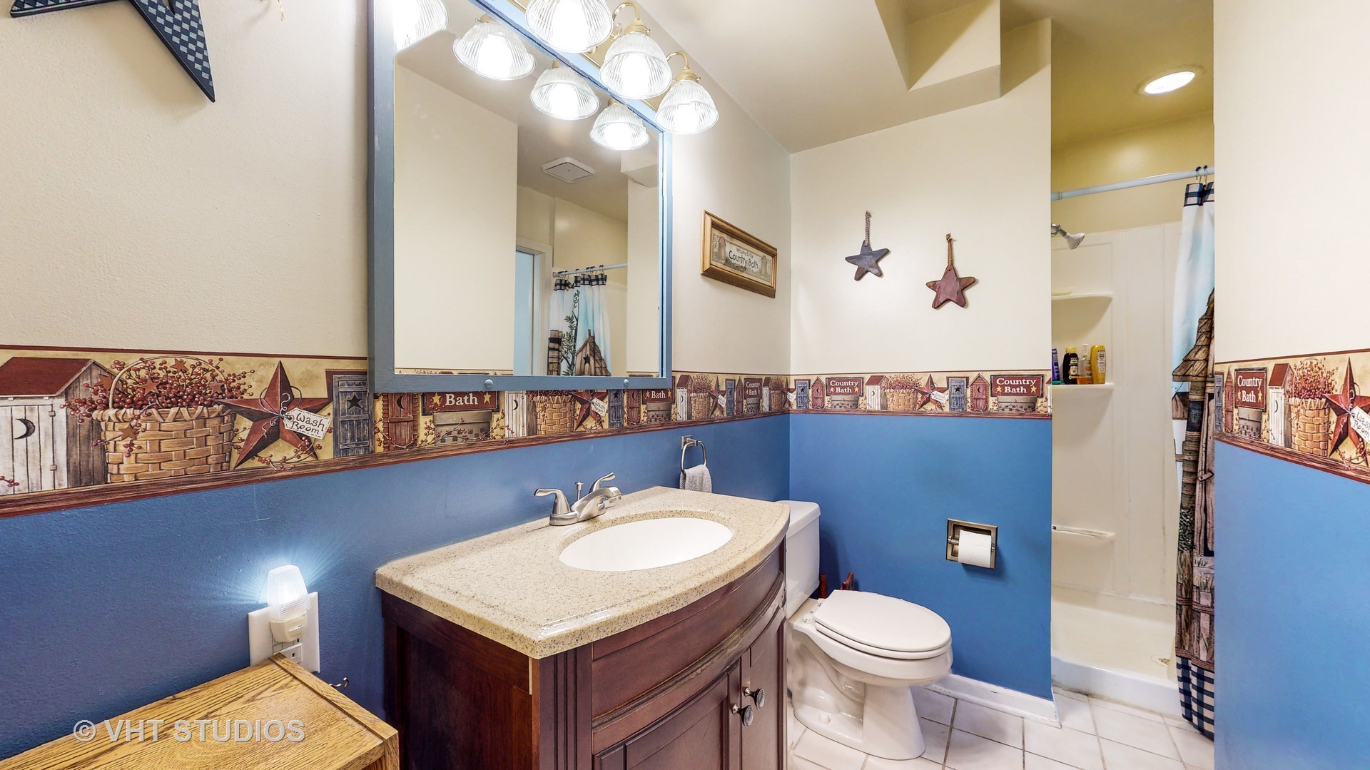 41W965 Empire Road St. Charles, IL 60175 - Photo 16 of 44 a bathroom with a sink toilet and mirror