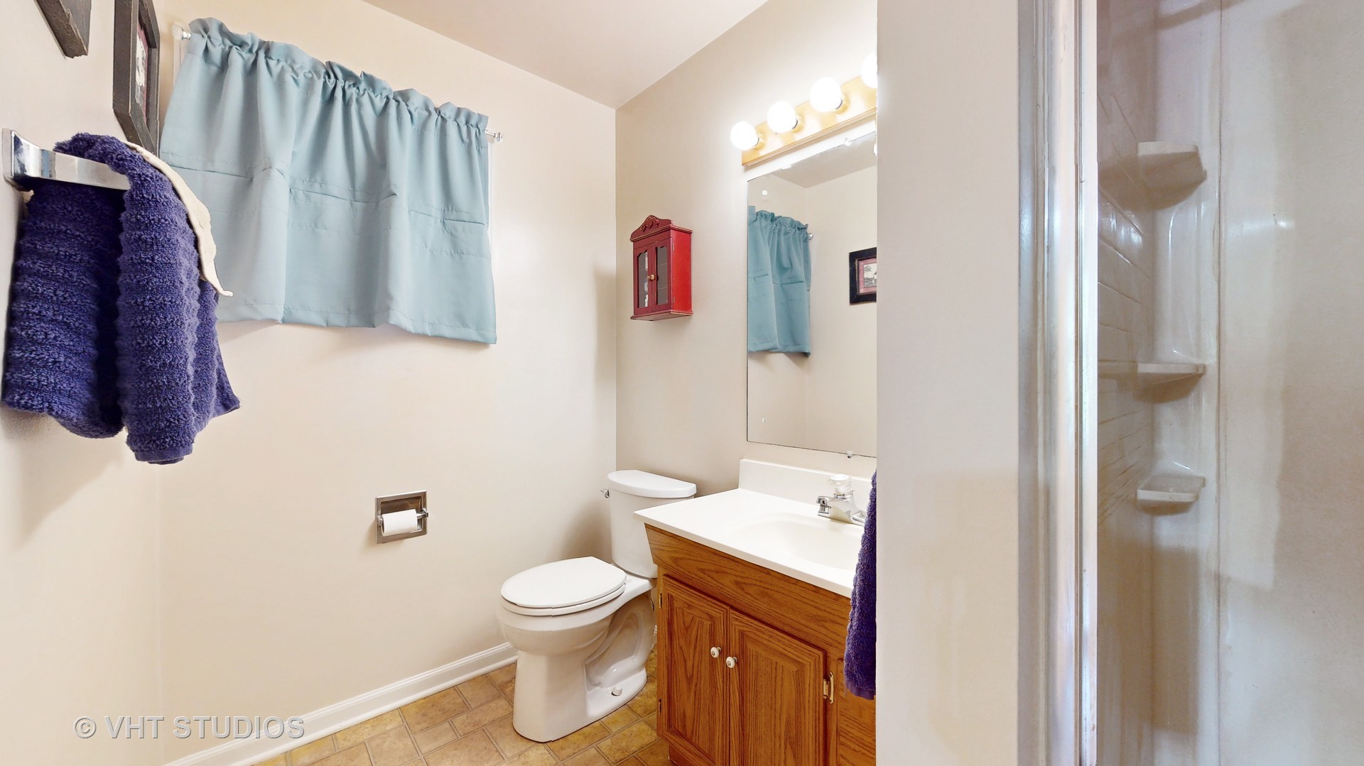 41W965 Empire Road St. Charles, IL 60175 - Photo 23 of 44 a bathroom with a toilet sink and mirror