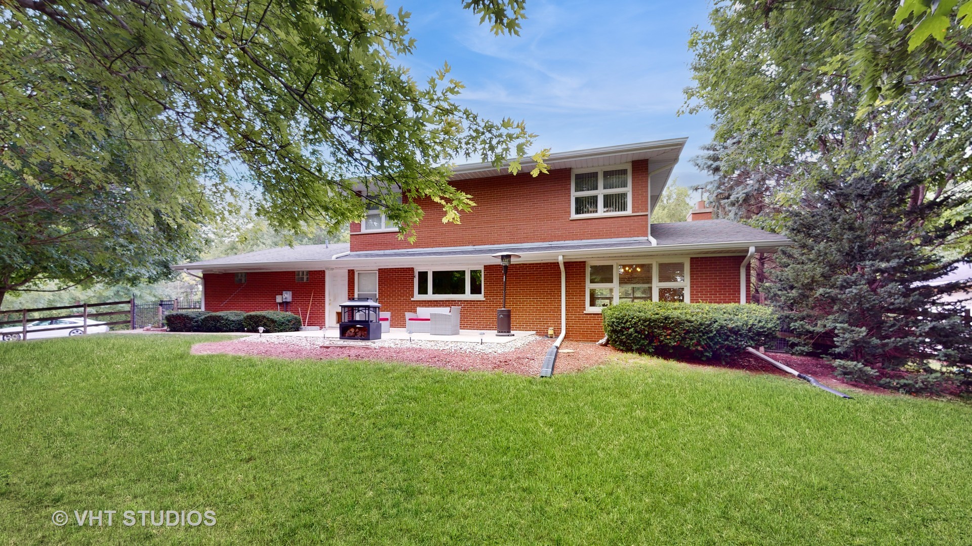 41W965 Empire Road St. Charles, IL 60175 - Photo 38 of 44 a front view of a house with a yard and trees