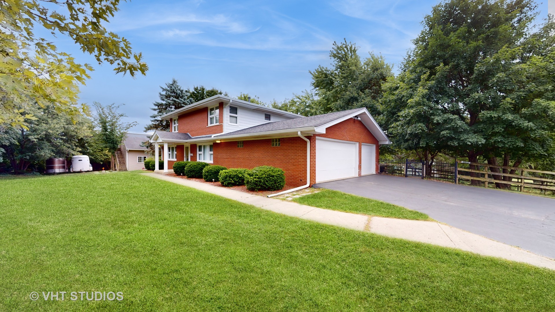 41W965 Empire Road St. Charles, IL 60175 - Photo 4 of 44 a front view of a house with a yard and trees