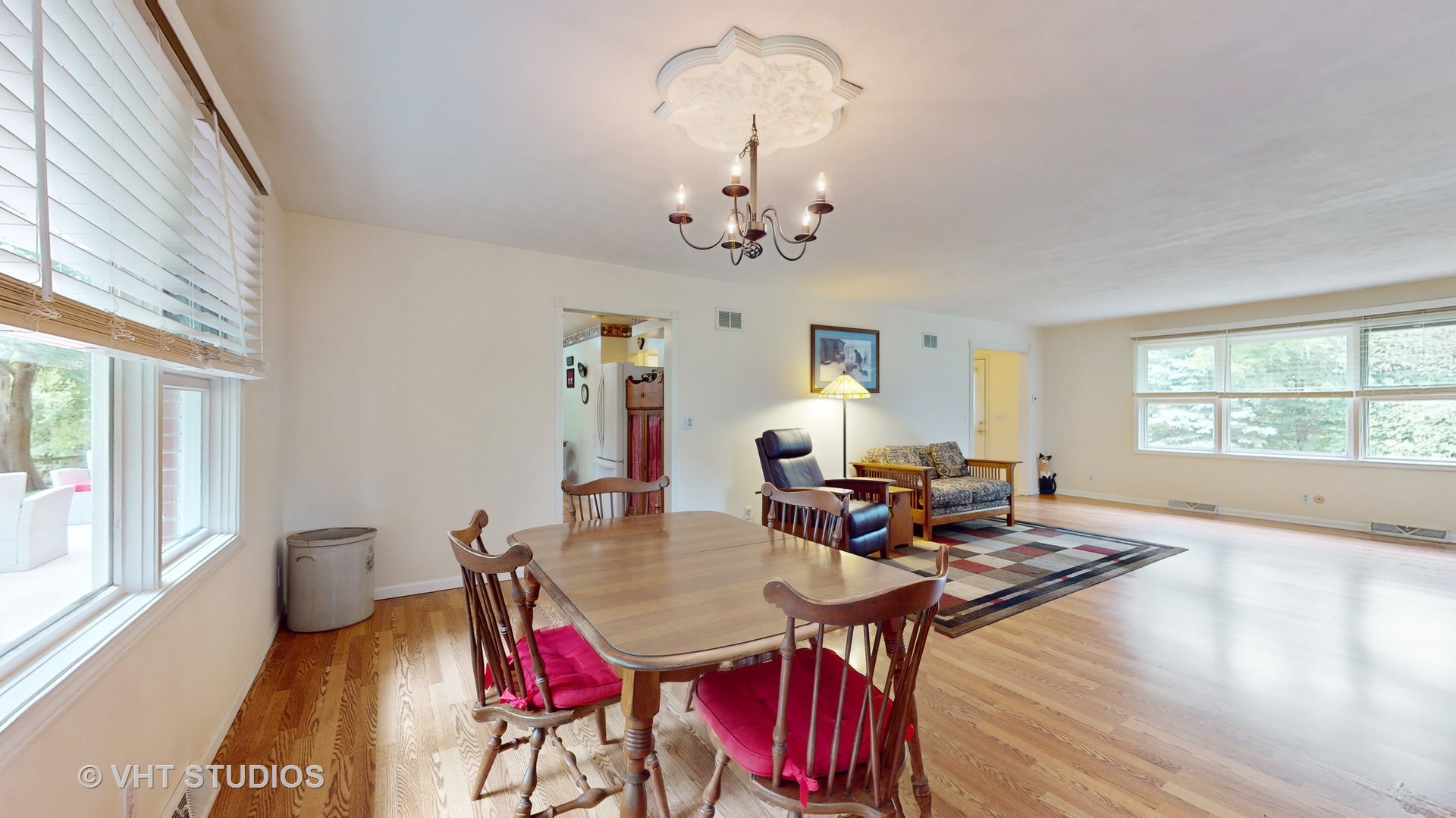41W965 Empire Road St. Charles, IL 60175 - Photo 10 of 44 a view of a dining room with furniture a chandelier and wooden floor