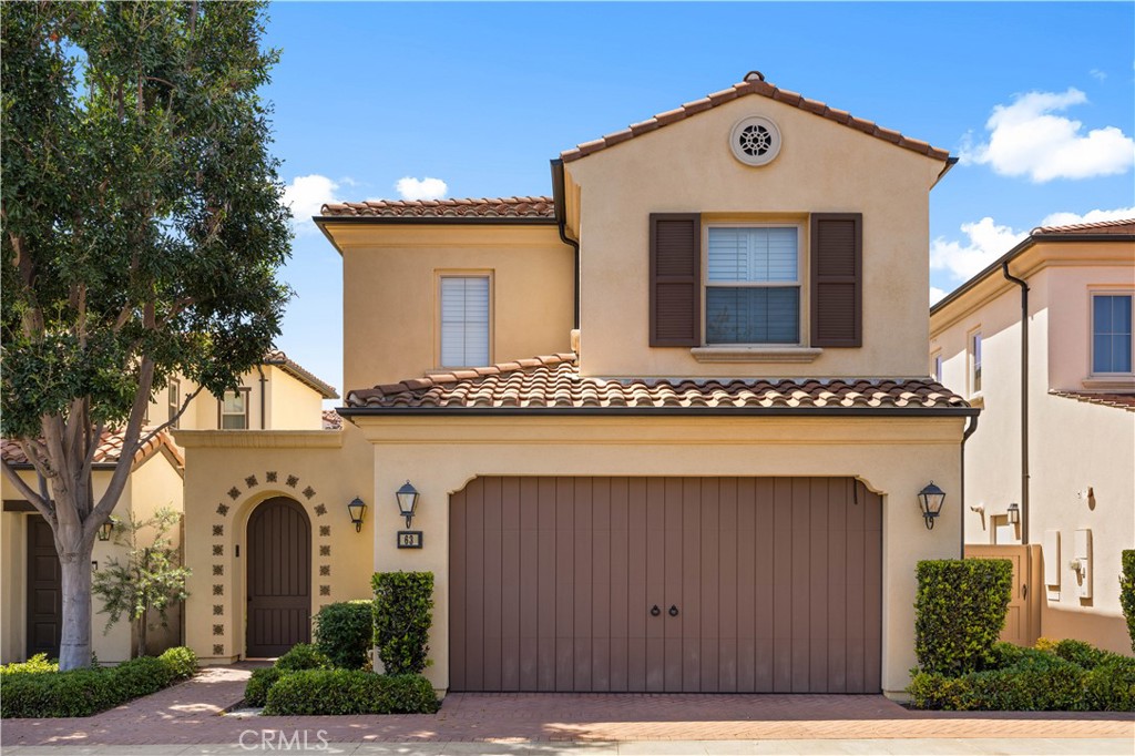63 Birmingham Irvine, CA 92620 - Photo 1 of 28 a front view of a house with a yard