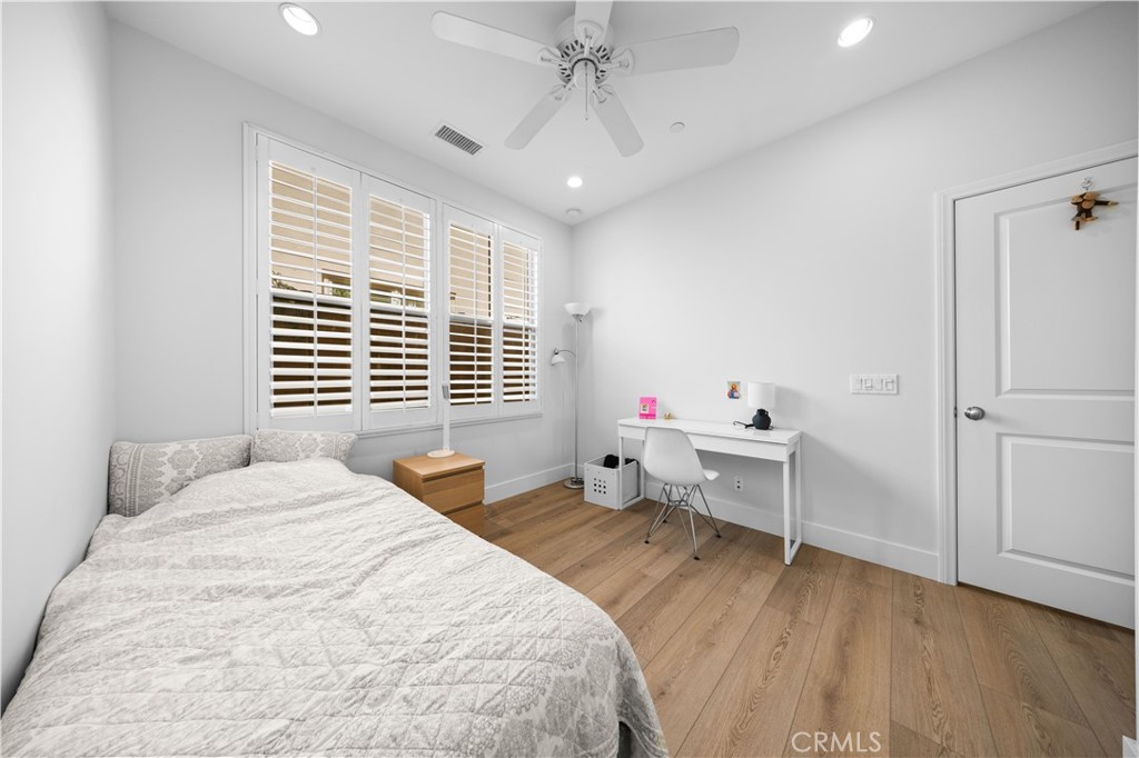 63 Birmingham Irvine, CA 92620 - Photo 13 of 28 a bedroom with a bed and a desk