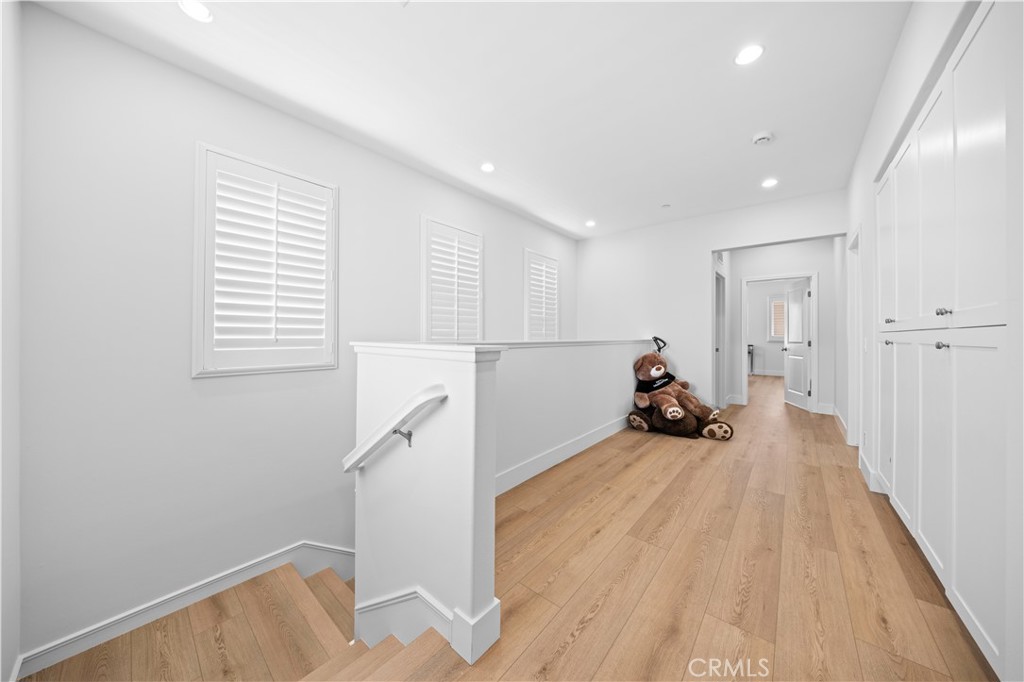 63 Birmingham Irvine, CA 92620 - Photo 15 of 28 a view of a room with wooden floor and stairs