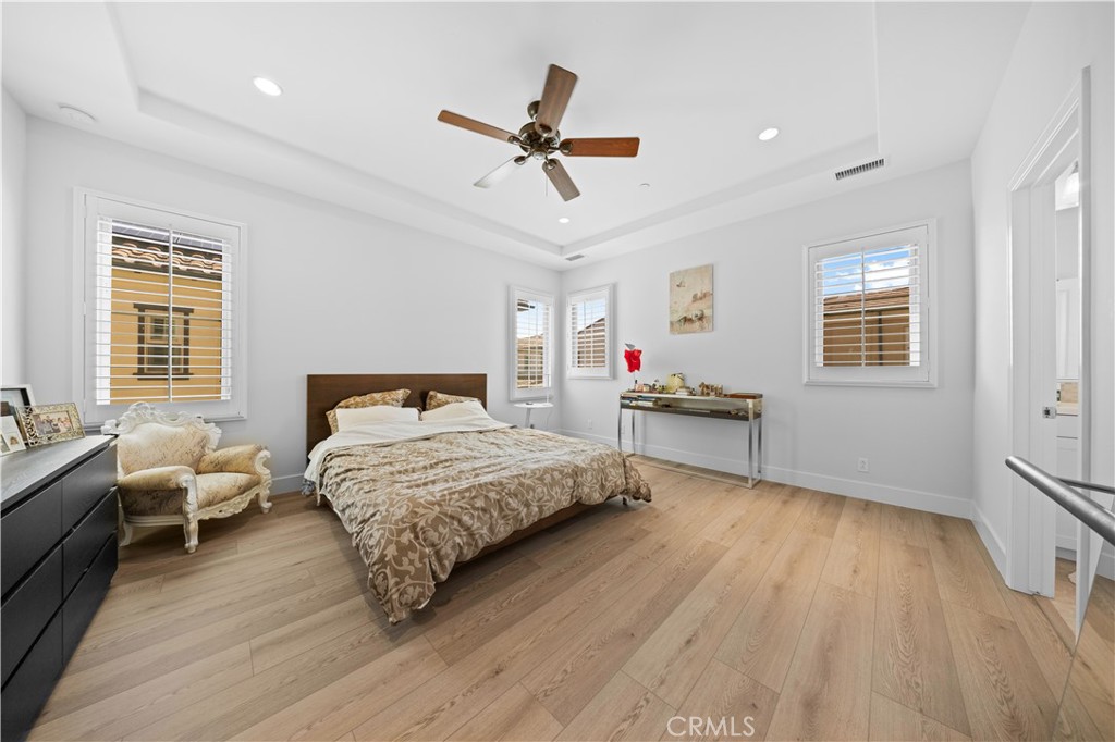 63 Birmingham Irvine, CA 92620 - Photo 16 of 28 a bedroom with a bed and wooden floor