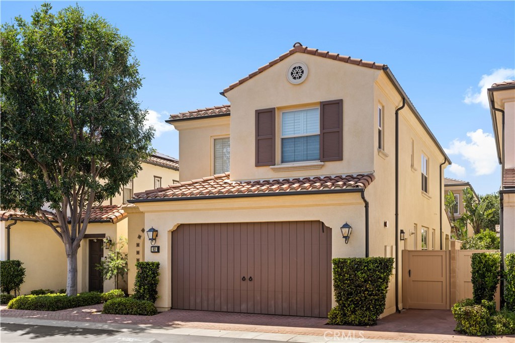 63 Birmingham Irvine, CA 92620 - Photo 2 of 28 a front view of a house with a garage