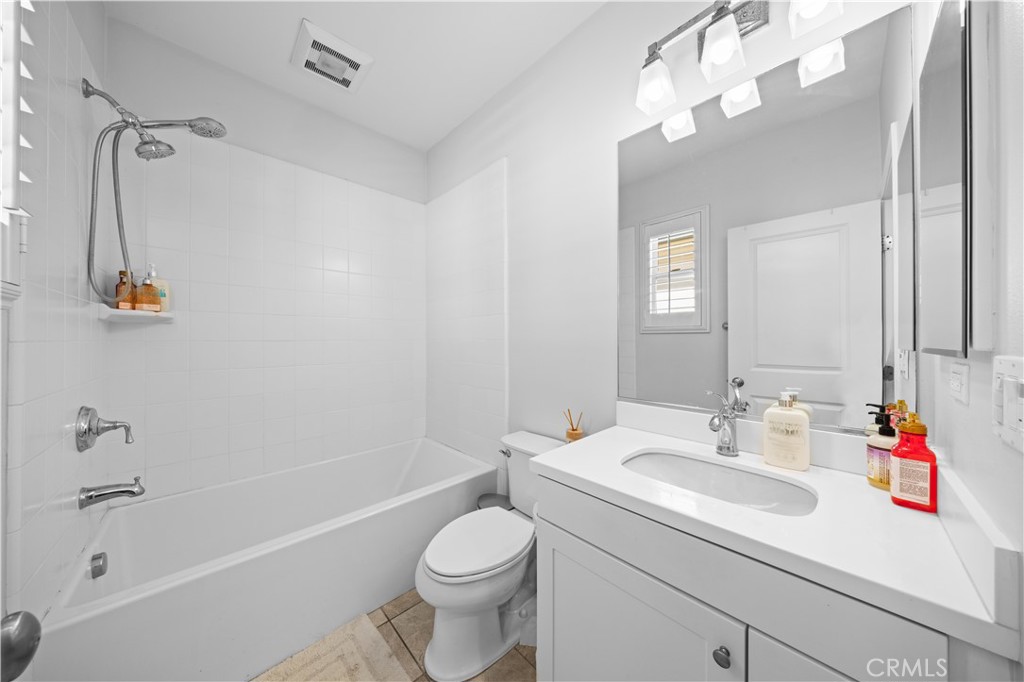 63 Birmingham Irvine, CA 92620 - Photo 21 of 28 a bathroom with a sink a toilet and shower