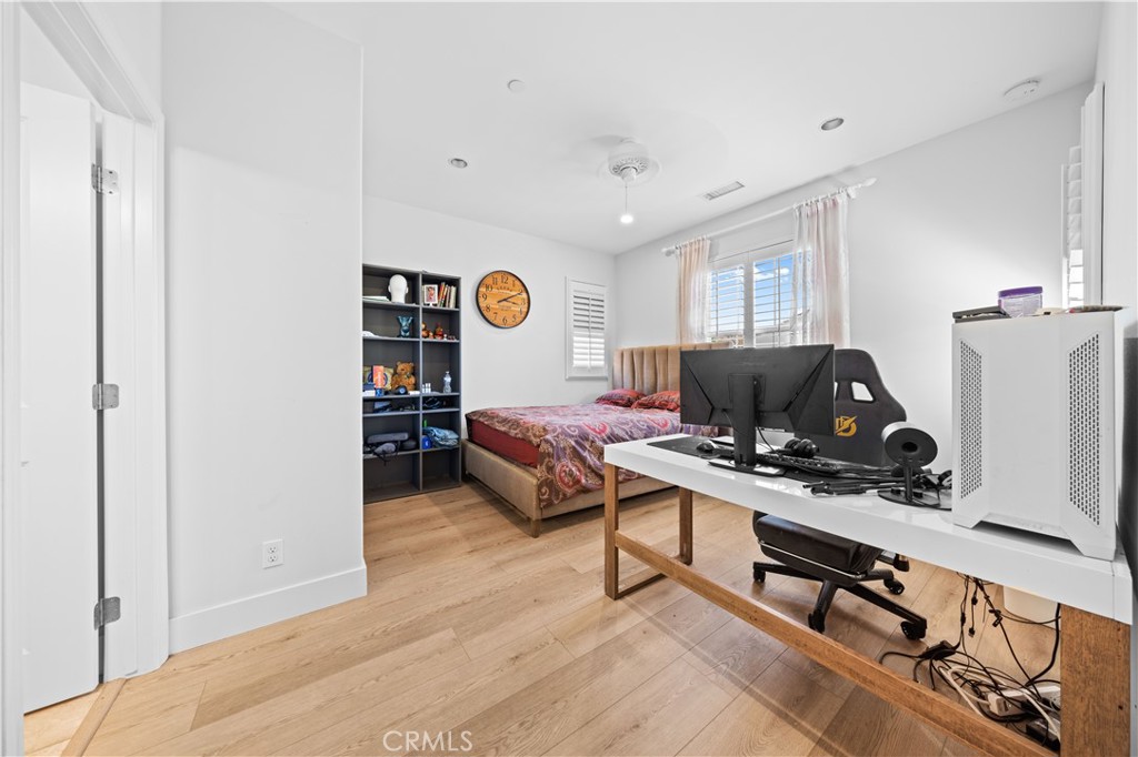 63 Birmingham Irvine, CA 92620 - Photo 22 of 28 a bedroom with furniture and a window