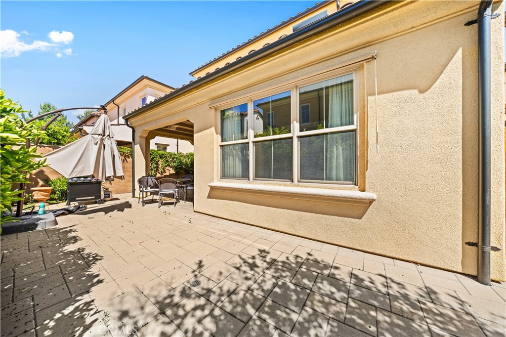 63 Birmingham Irvine, CA 92620 - Photo 25 of 28 a front view of a house with a yard