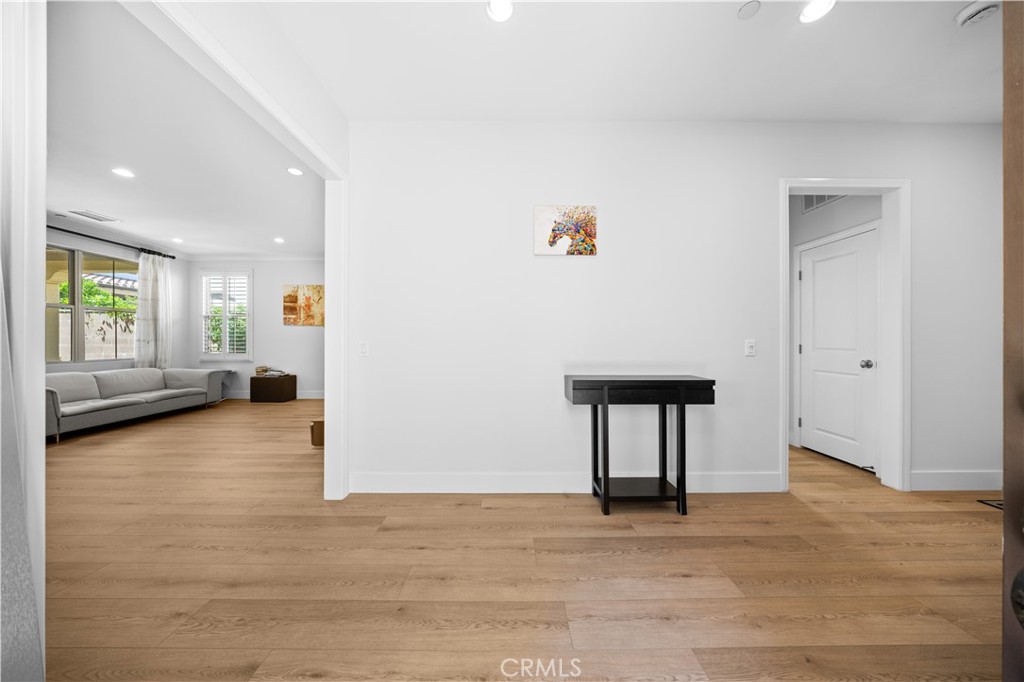 63 Birmingham Irvine, CA 92620 - Photo 4 of 28 a view of an empty room with a window and wooden floor