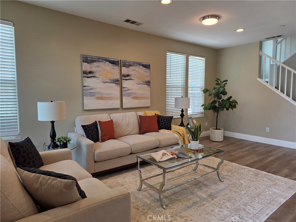 20329 Red Poppy Lane Riverside, CA 92508 - Photo 4 of 24 a living room with furniture and a large window
