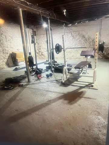 a view of a yard with a car parked on the road