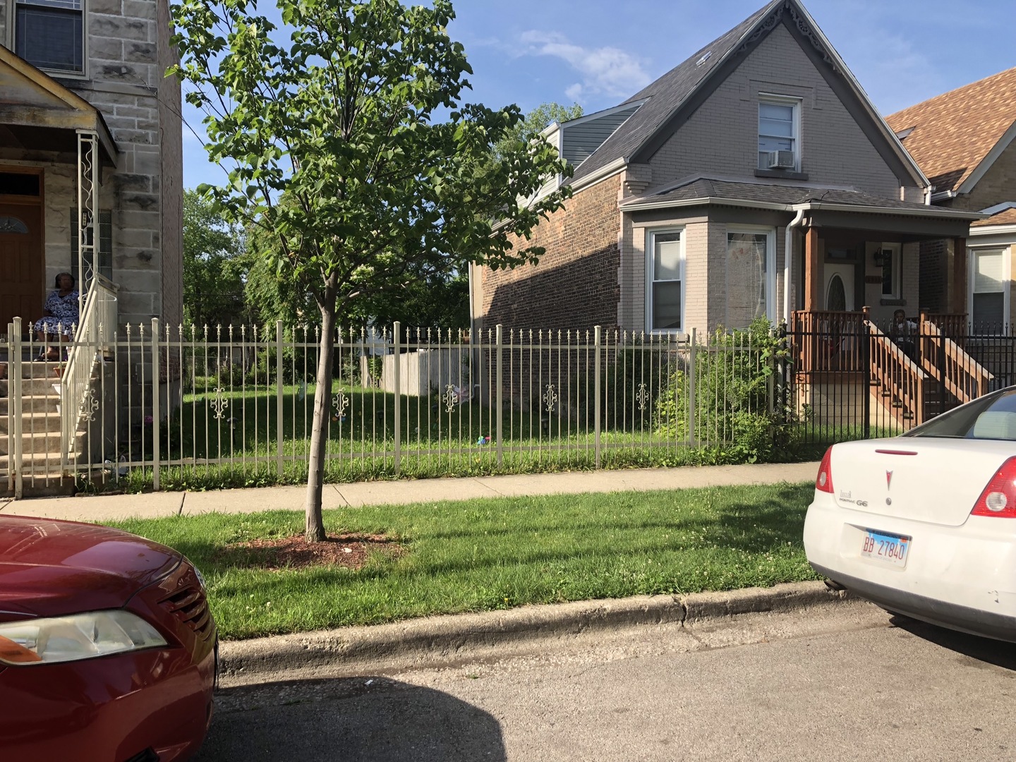 3909 West Fillmore Street Chicago, IL 60624 - Photo 2 of 4 a front view of a house with a yard table and chairs