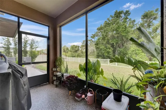 a living room with furniture and a mirror