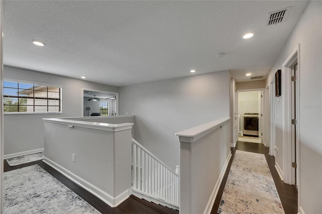 5057 Ivory Stone Drive Wimauma, FL 33598 - Photo 23 of 46 a view of hallway with stairs