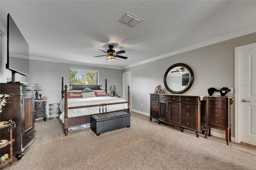 5057 Ivory Stone Drive Wimauma, FL 33598 - Photo 27 of 46 a living room with furniture and a mirror