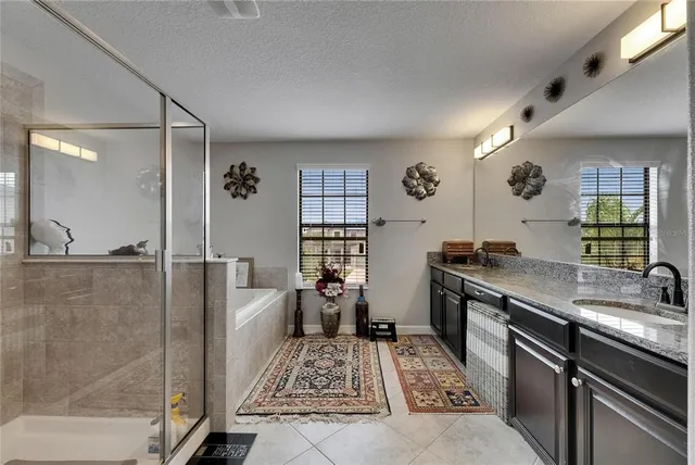 a bathroom with a tub and a shower