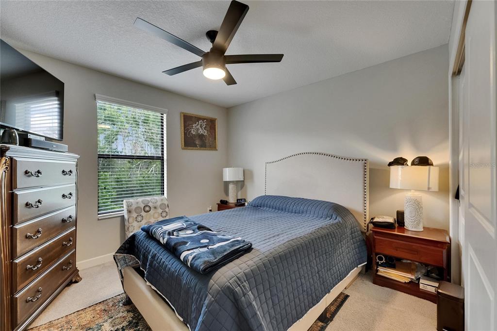 5057 Ivory Stone Drive Wimauma, FL 33598 - Photo 33 of 46 a bedroom with a bed and a window