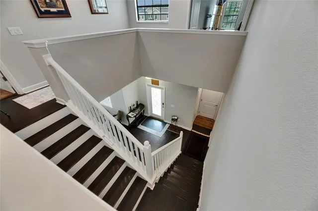 an aerial view of a house with a garden and swimming pool