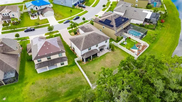 a view of a house with backyard and porch