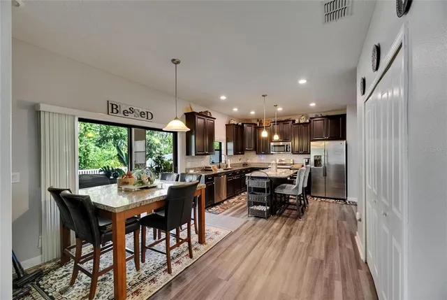 a kitchen with granite countertop a sink and a window