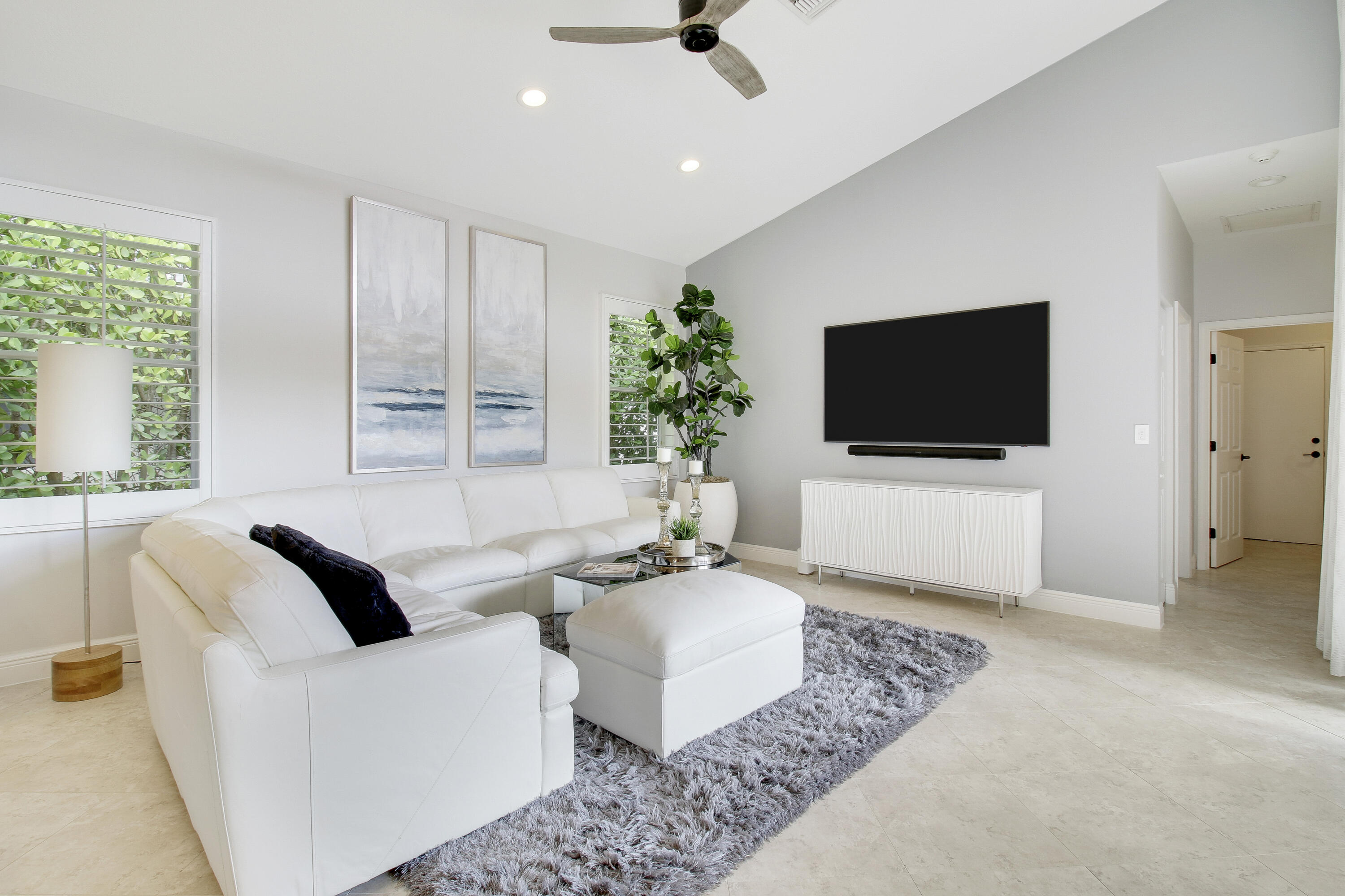 7606 La Corniche Circle Boca Raton, FL 33433 - Photo 23 of 49 a living room with furniture and a flat screen tv