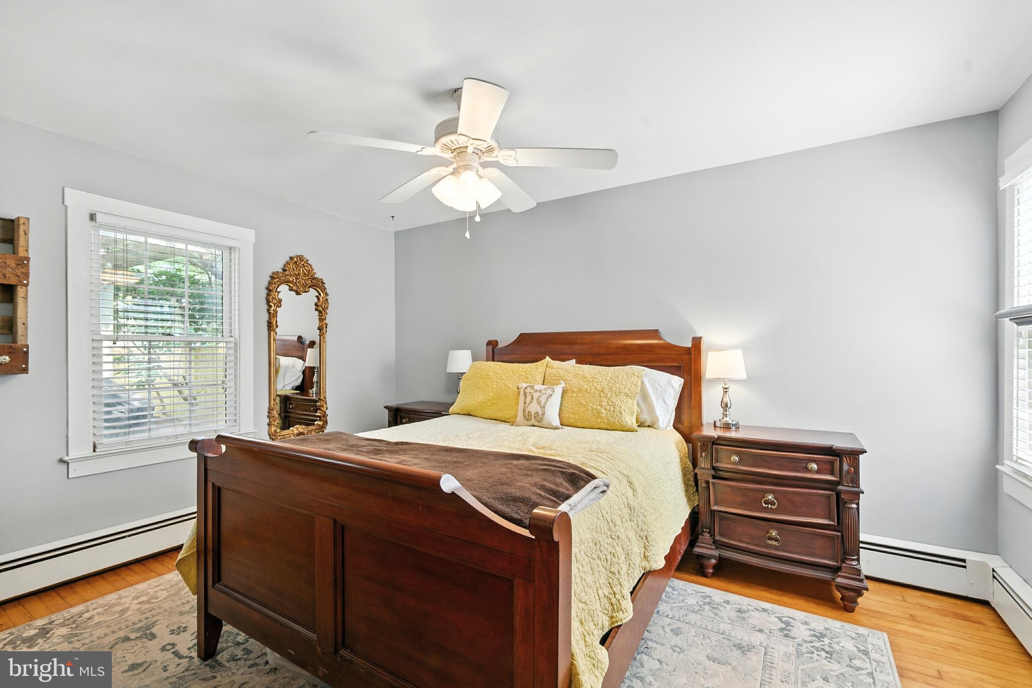 110 South Mill Street Chestertown, MD 21620 - Photo 12 of 39 a bedroom with a bed and a chandelier