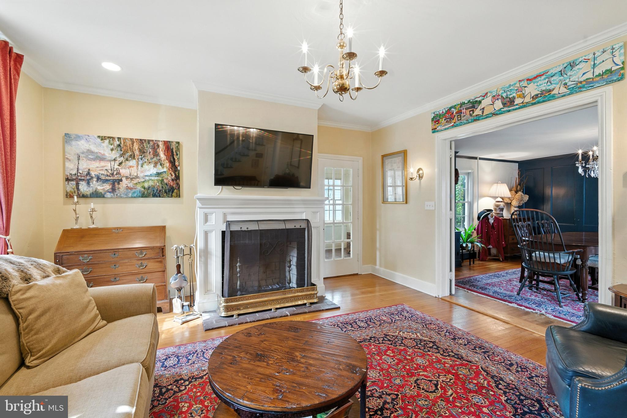 110 South Mill Street Chestertown, MD 21620 - Photo 5 of 39 a living room with furniture a flat screen tv and a fireplace