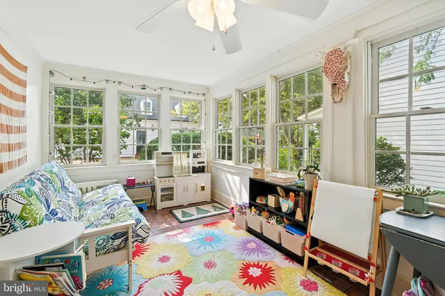 a bed room with furniture and a window