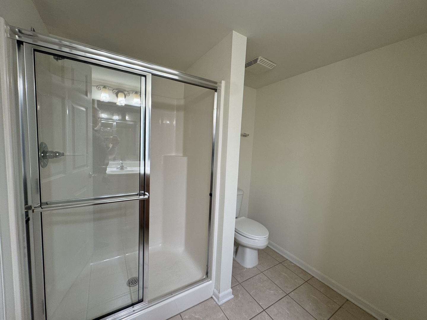 30 Nugent Street, Unit 430 Glenwood, IL 60425 - Photo 11 of 18 a bathroom with a glass shower door