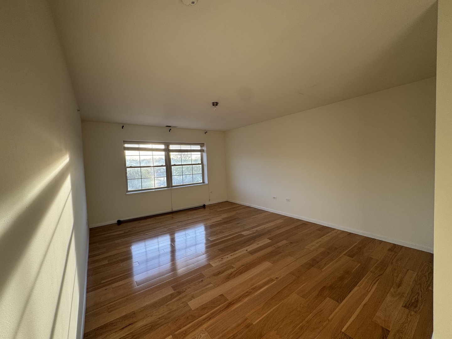 30 Nugent Street, Unit 430 Glenwood, IL 60425 - Photo 6 of 18 a view of empty room with wooden floor and fan