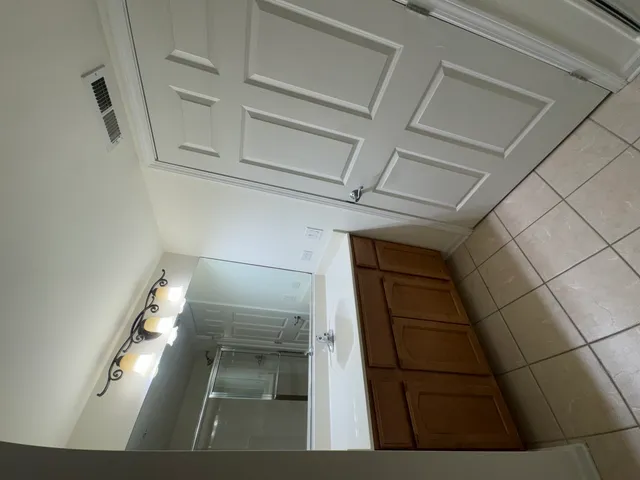 a bathroom with a glass shower door