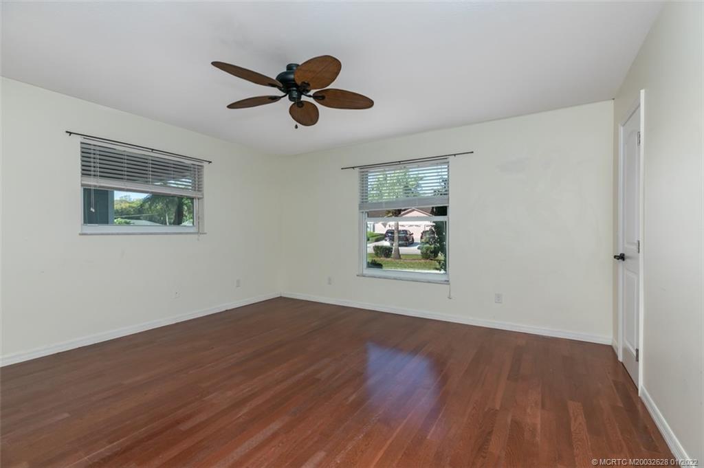 2891 Southeast Farley Road Port St. Lucie, FL 34952 - Photo 20 of 53 a view of empty room with wooden floor and window