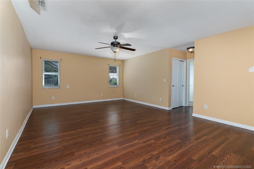 2891 Southeast Farley Road Port St. Lucie, FL 34952 - Photo 25 of 53 a view of an empty room with wooden floor and a window