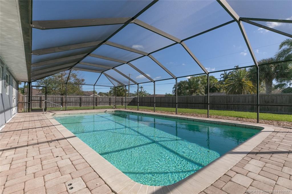 2891 Southeast Farley Road Port St. Lucie, FL 34952 - Photo 29 of 53 a view of a backyard with swimming pool
