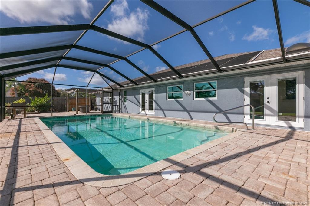 2891 Southeast Farley Road Port St. Lucie, FL 34952 - Photo 31 of 53 a view of a backyard with sitting area