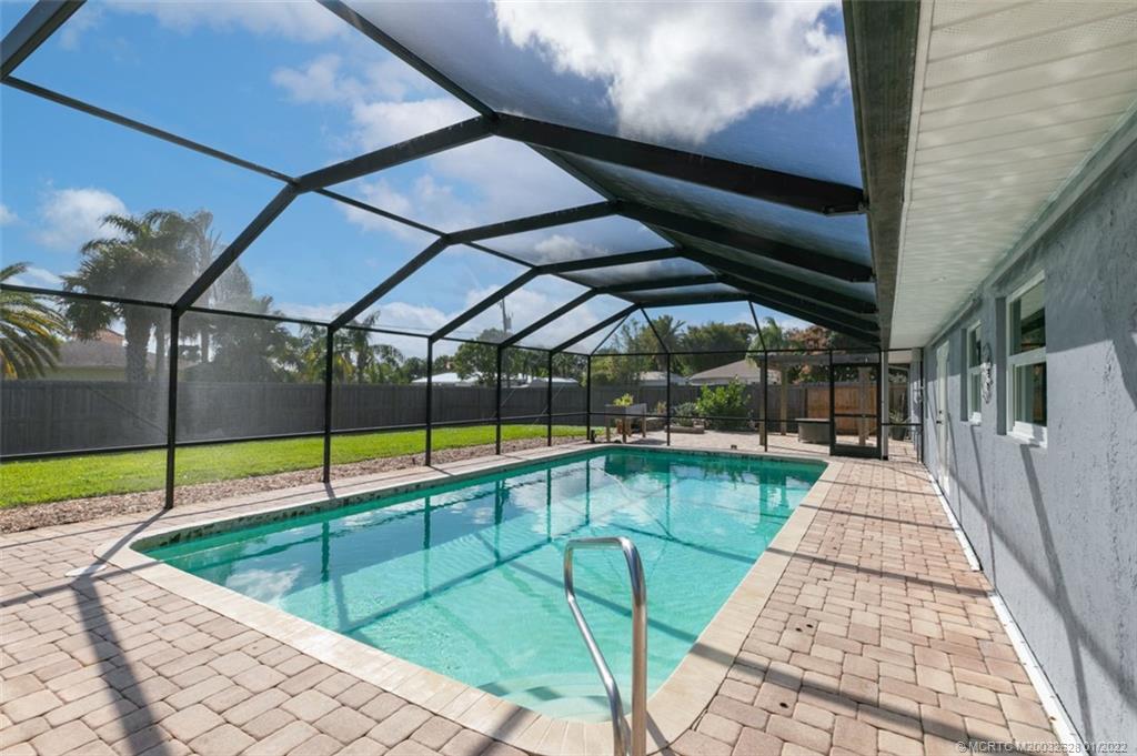 2891 Southeast Farley Road Port St. Lucie, FL 34952 - Photo 33 of 53 a view of swimming pool with seating area