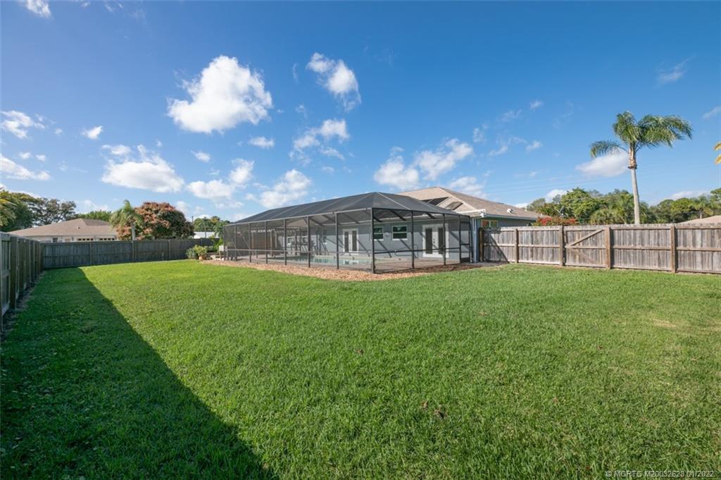 2891 Southeast Farley Road Port St. Lucie, FL 34952 - Photo 35 of 53 a view of a house with a big yard