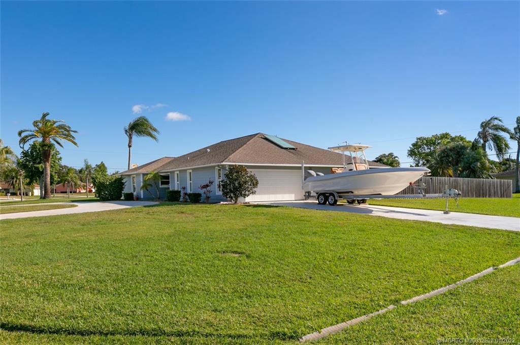 2891 Southeast Farley Road Port St. Lucie, FL 34952 - Photo 42 of 53 a front view of a house with garden