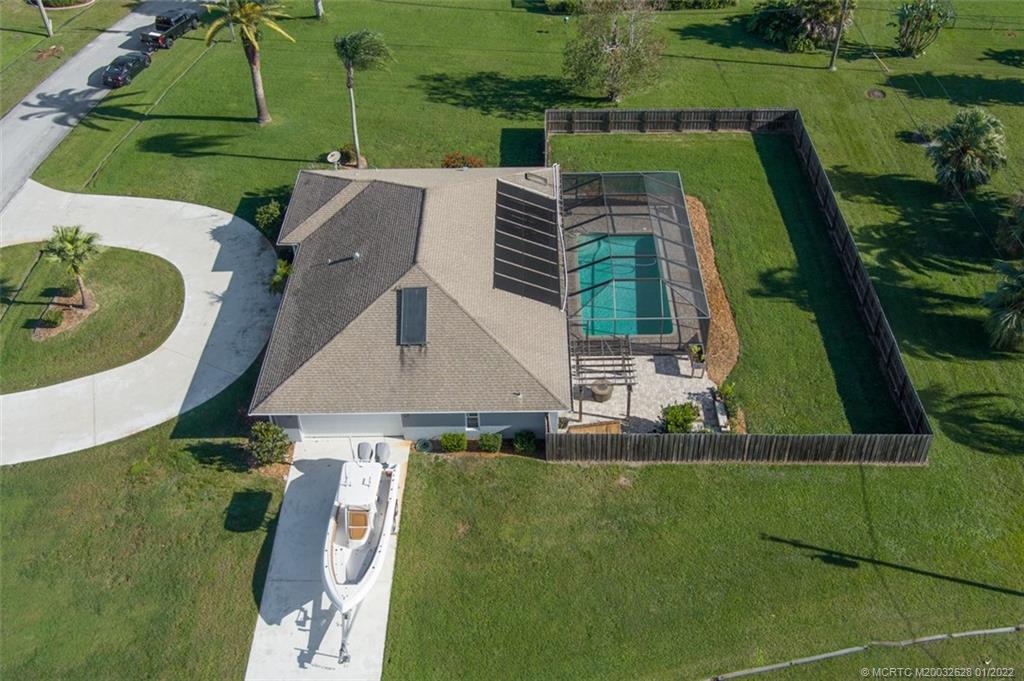 2891 Southeast Farley Road Port St. Lucie, FL 34952 - Photo 43 of 53 an aerial view of a house with a garden