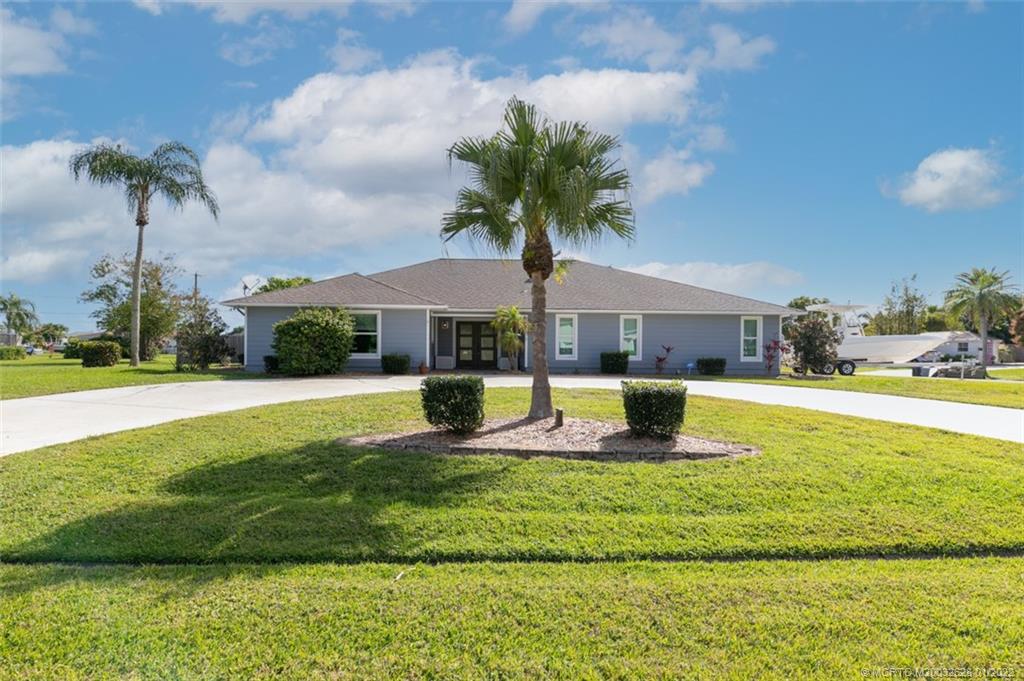 2891 Southeast Farley Road Port St. Lucie, FL 34952 - Photo 53 of 53 a view of a house with a swimming pool