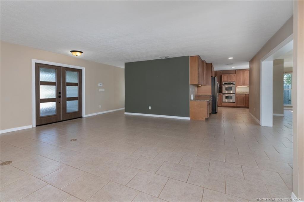 2891 Southeast Farley Road Port St. Lucie, FL 34952 - Photo 10 of 53 a view of an empty room with a window