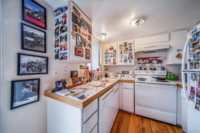 a kitchen with stainless steel appliances a stove top oven