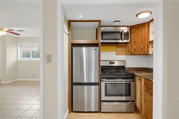 a kitchen with a stove and a microwave